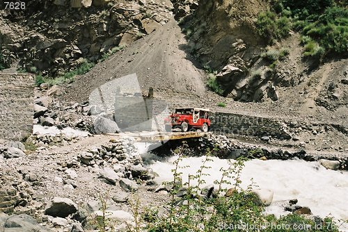 Image of jeep crossing stream