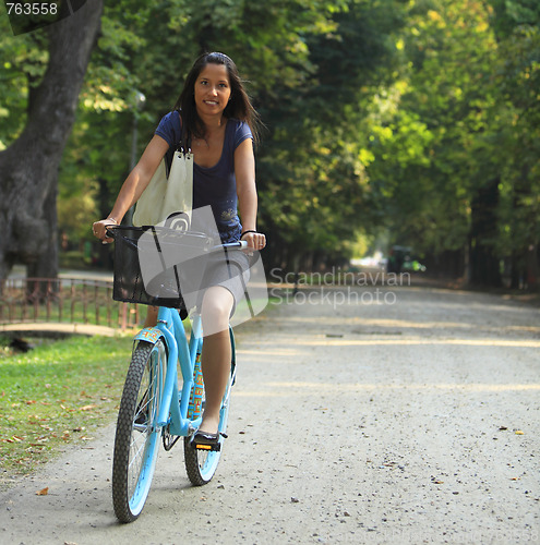 Image of Woman Riding A Bicycle