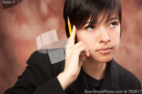 Image of Multiethnic Girl Ponders While Holding Pencil