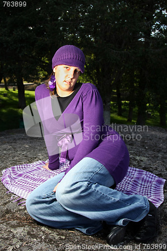 Image of  beautiful woman in an autumn park 