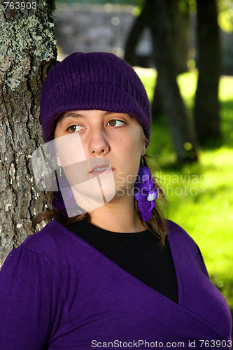 Image of  beautiful woman in an autumn park 