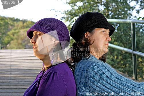 Image of  beautiful woman in an autumn park 