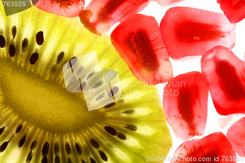 Image of beautiful and fresh pomegranate grains and kiwi