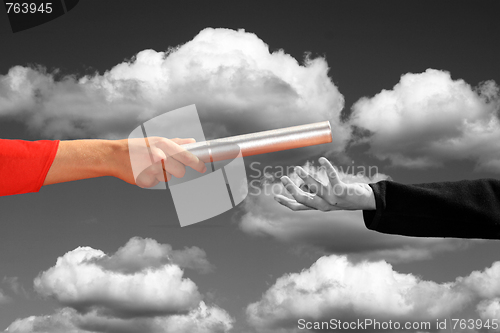 Image of hands passing the baton