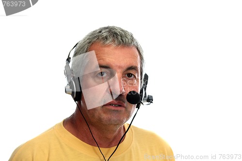 Image of mature man in a business call center