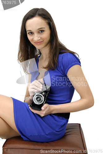 Image of casual young woman photographer