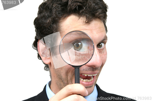 Image of businessman with magnifying glass