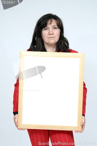 Image of Young woman holding blank board