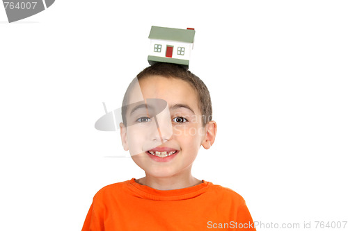 Image of boy holdind a toy house