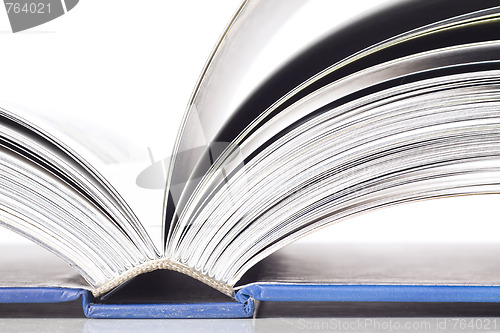Image of open book and pen