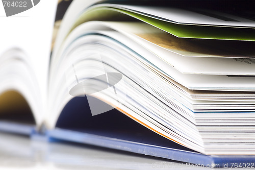 Image of open book and pen