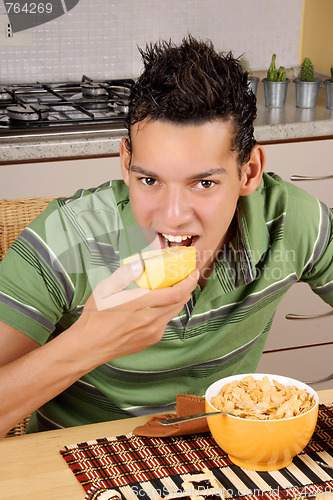Image of Young man having breakfast