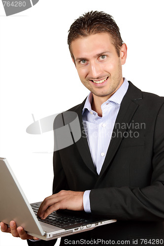 Image of Young businessman with laptop