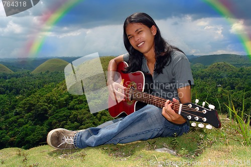 Image of Smiling guitar player u rainbow