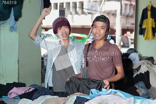 Image of Asian teens shopping in oriental bazaar