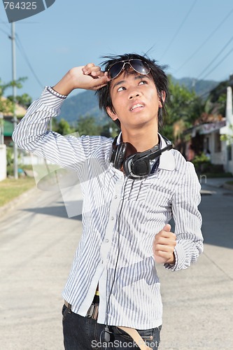 Image of Asian teen looking at sun