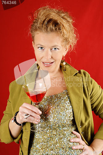 Image of Beautiful blond woman with red drink