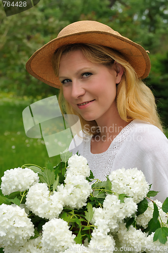 Image of Young woman with snowballs