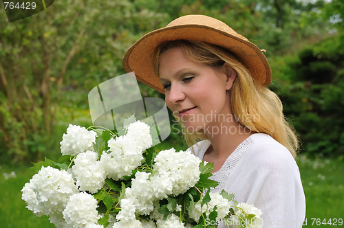 Image of Young woman with snowballs