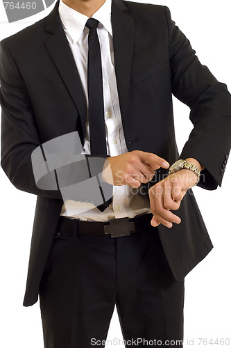 Image of businessman looking at his watch