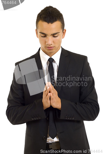 Image of businessman praying