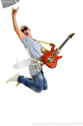 Image of   Passionate guitarist jumps isolated on white