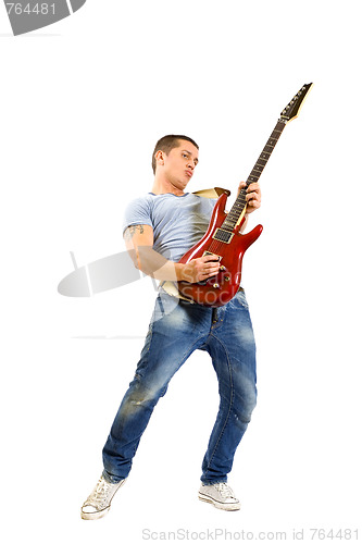 Image of Passionate guitarist playing isolated on white