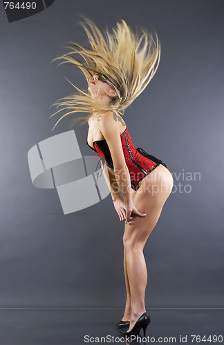 Image of  woman in lingerie with fluttering hair