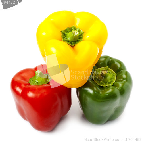 Image of Three sweet peppers in yellow, red and green