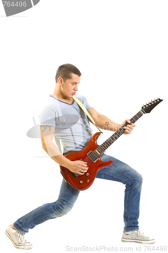 Image of  man playing his guitar