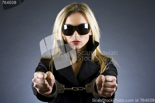 Image of woman with handcuffs on