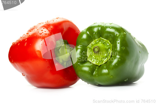 Image of red and green peppers with water drops on