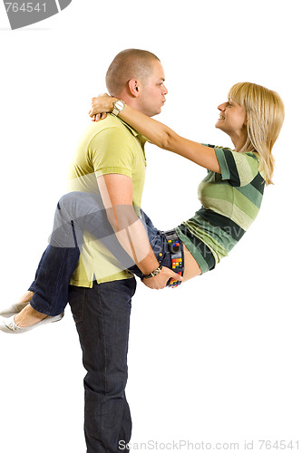 Image of young man holding his girlfriend