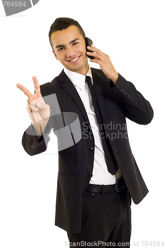 Image of businessman on the phone making his victory sign