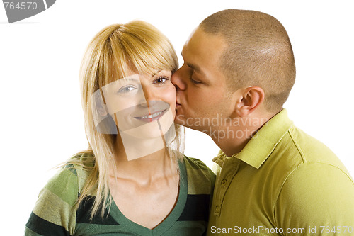 Image of Man kisses young woman