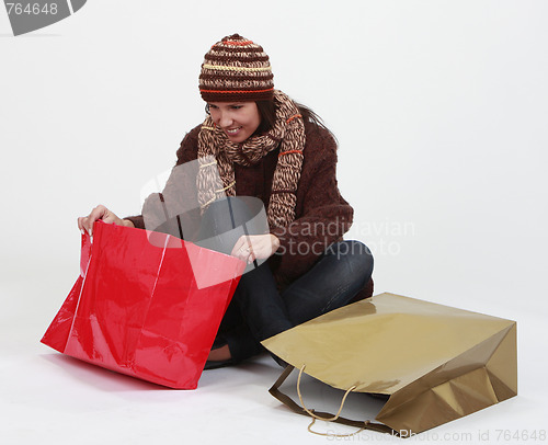 Image of Young woman searching for gifts