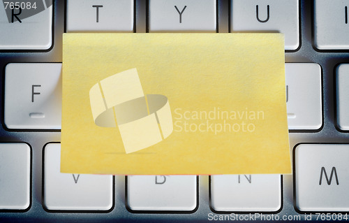 Image of Sticky note on laptop keyboard