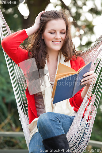 Image of Teenager reading a book