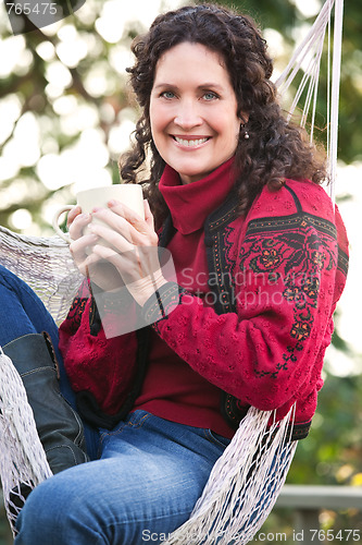 Image of Mature woman drinking coffee