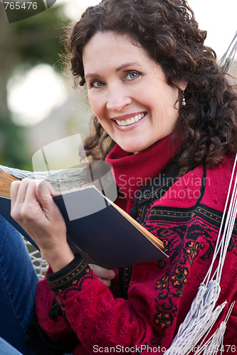 Image of Mature woman reading a book