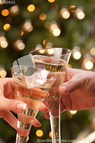 Image of Man and Woman Toasting Champagne in Front of Lights