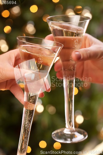 Image of Man and Woman Toasting Champagne in Front of Lights