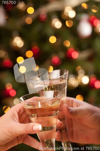 Image of Man and Woman Toasting Champagne in Front of Lights