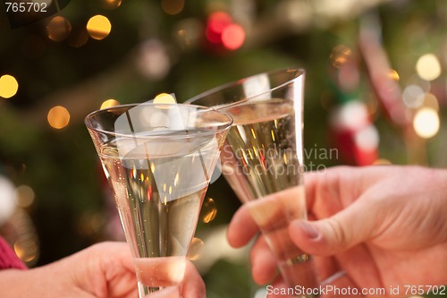 Image of Man and Woman Toasting Champagne in Front of Lights