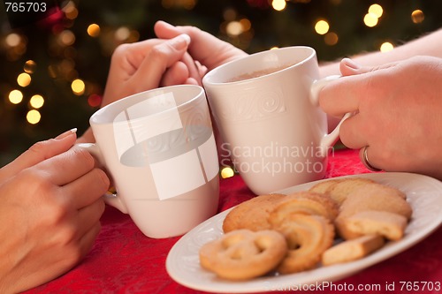 Image of Man and Woman Sharing Hot Chocolate and Cookies