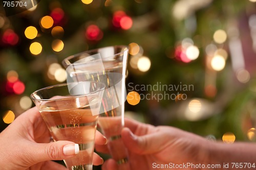 Image of Man and Woman Toasting Champagne in Front of Lights