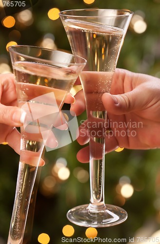 Image of Man and Woman Toasting Champagne in Front of Lights