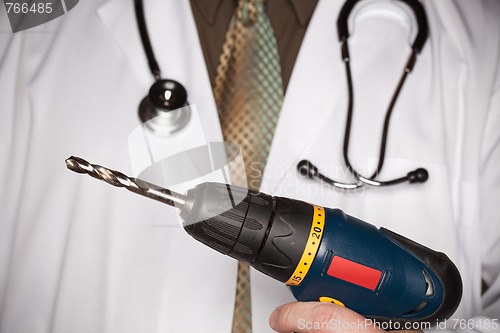 Image of Doctor with Stethoscope Holding Big Drill