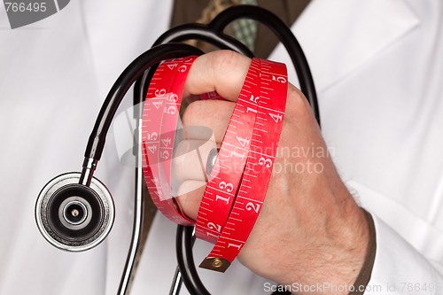 Image of Doctor with Stethoscope Holding Measuring Tape