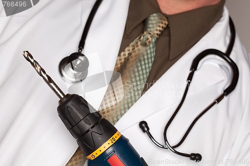 Image of Doctor with Stethoscope Holding Big Drill